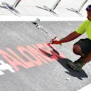Pit lane markings are applied at Formula One World Championship, Rd12, Hungarian Grand Prix, Preparations, Hungaroring, Hungary, Thursday 26 July 2018. © Mark Sutton/Sutton Images