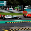 Kimi Raikkonen, Ferrari SF71H, Sebastian Vettel, Ferrari SF71H and Lewis Hamilton, Mercedes AMG F1 W09 battle on lap one at Formula One World Championship, Rd14, Italian Grand Prix, Race, Monza, Italy, Sunday 2 September 2018. © Manuel Goria/Sutton Images