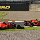 Kimi Raikkonen, Ferrari SF71H and Max Verstappen, Red Bull Racing RB14 battle at Formula One World Championship, Rd17, Japanese Grand Prix, Race, Suzuka, Japan, Sunday 7 October 2018.