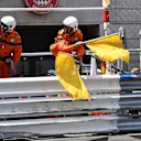 Marshals wave the yellow flags after the crash of Max Verstappen (NED) Red Bull Racing RB14 at Formula One World Championship, Rd6, Monaco Grand Prix, Qualifying, Monte-Carlo, Monaco, Saturday 26 May 2018. © Mark Sutton/Sutton Images