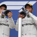 Valtteri Bottas, Mercedes AMG F1 and Lewis Hamilton, Mercedes AMG F1 with the champagne on the podium at Formula One World Championship, Rd16, Russian Grand Prix, Race, Sochi Autodrom, Sochi, Krasnodar Krai, Russia, Sunday 30 September 2018.