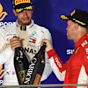 Lewis Hamilton, Mercedes AMG F1 and Sebastian Vettel, Ferrari celebrate on the podium with the champagne at Formula One World Championship, Rd15, Singapore Grand Prix, Race, Marina Bay Circuit, Singapore, Sunday 16 September 2018.