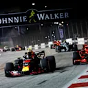 Max Verstappen, Red Bull Racing RB14 and Sebastian Vettel, Ferrari SF71H battle on lap one at Formula One World Championship, Rd15, Singapore Grand Prix, Race, Marina Bay Circuit, Singapore, Sunday 16 September 2018.