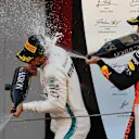 Race winner Lewis Hamilton (GBR) Mercedes-AMG F1 and Max Verstappen (NED) Red Bull Racing celebrate on the podium with the champagne at Formula One World Championship, Rd5, Spanish Grand Prix, Race, Barcelona, Spain, Sunday 13 May 2018. © Mark Sutton/Sutton Images