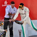 Lewis Hamilton (GBR) Mercedes-AMG F1 and Valtteri Bottas (FIN) Mercedes-AMG F1 celebrate on the podium with the champagne at Formula One World Championship, Rd5, Spanish Grand Prix, Race, Barcelona, Spain, Sunday 13 May 2018. © Jerry Andre/Sutton Images