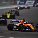 ABU DHABI, UNITED ARAB EMIRATES - DECEMBER 01: Carlos Sainz of Spain driving the (55) McLaren F1 Team MCL34 Renault leads Daniel Ricciardo of Australia driving the (3) Renault Sport Formula One Team RS19 on track during the F1 Grand Prix of Abu Dhabi at Yas Marina Circuit on December 01, 2019 in Abu Dhabi, United Arab Emirates. (Photo by Clive Mason/Getty Images)