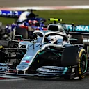 ABU DHABI, UNITED ARAB EMIRATES - DECEMBER 01: Valtteri Bottas driving the (77) Mercedes AMG Petronas F1 Team Mercedes W10 leads Daniil Kvyat driving the (26) Scuderia Toro Rosso STR14 Honda on track during the F1 Grand Prix of Abu Dhabi at Yas Marina Circuit on December 01, 2019 in Abu Dhabi, United Arab Emirates. (Photo by Francois Nel/Getty Images)