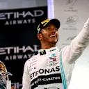 ABU DHABI, UNITED ARAB EMIRATES - DECEMBER 01: Race winner Lewis Hamilton of Great Britain and Mercedes GP celebrates on the podium during the F1 Grand Prix of Abu Dhabi at Yas Marina Circuit on December 01, 2019 in Abu Dhabi, United Arab Emirates. (Photo by Dan Istitene/Getty Images)