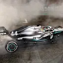 ABU DHABI, UNITED ARAB EMIRATES - DECEMBER 01: Race winner Lewis Hamilton of Great Britain and Mercedes GP celebrates with donuts on track during the F1 Grand Prix of Abu Dhabi at Yas Marina Circuit on December 01, 2019 in Abu Dhabi, United Arab Emirates. (Photo by Mark Thompson/Getty Images)
