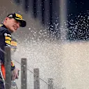 ABU DHABI, UNITED ARAB EMIRATES - DECEMBER 01: Second placed Max Verstappen of Netherlands and Red Bull Racing celebrates on the podium during the F1 Grand Prix of Abu Dhabi at Yas Marina Circuit on December 01, 2019 in Abu Dhabi, United Arab Emirates. (Photo by Mark Thompson/Getty Images)