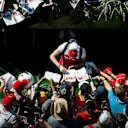 RED BULL RING, AUSTRIA - JUNE 29: Antonio Giovinazzi, Alfa Romeo Racing signs a autograph for a fan during the Austrian GP at Red Bull Ring on June 29, 2019 in Red Bull Ring, Austria. (Photo by Zak Mauger / LAT Images)