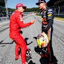 RED BULL RING, AUSTRIA - JUNE 29: Pole man Charles Leclerc, Ferrari, talks with Max Verstappen, Red Bull Racing, after Qualifying during the Austrian GP at Red Bull Ring on June 29, 2019 in Red Bull Ring, Austria. (Photo by Steven Tee / LAT Images)