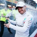 BAKU CITY CIRCUIT, AZERBAIJAN - APRIL 28: Race Winner Valtteri Bottas, Mercedes AMG F1 celebrates with the champagne and his team during the Azerbaijan GP at Baku City Circuit on April 28, 2019 in Baku City Circuit, Azerbaijan. (Photo by Joe Portlock / LAT Images)