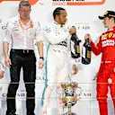 BAHRAIN INTERNATIONAL CIRCUIT, BAHRAIN - MARCH 31: Valtteri Bottas, Mercedes AMG F1, 2nd position, Andy Cowell, Managing Director, HPP, Mercedes AMG, Lewis Hamilton, Mercedes AMG F1, 1st position, and Charles Leclerc, Ferrari, 3rd position, on the podium during the Bahrain GP at Bahrain International Circuit on March 31, 2019 in Bahrain International Circuit, Bahrain. (Photo by Glenn Dunbar / LAT Images)