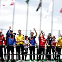 SAO PAULO, BRAZIL - NOVEMBER 17: Drivers including Daniil Kvyat of Russia and Scuderia Toro Rosso, Nico Hulkenberg of Germany and Renault Sport F1, Pierre Gasly of France driving the (10) Scuderia Toro Rosso STR14 Honda, Sebastian Vettel of Germany and Ferrari and Sergio Perez of Mexico and Racing Point are seen on the drivers parade before the F1 Grand Prix of Brazil at Autodromo Jose Carlos Pace on November 17, 2019 in Sao Paulo, Brazil. (Photo by Peter Fox/Getty Images)