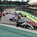 SAO PAULO, BRAZIL - NOVEMBER 17: Lewis Hamilton of Great Britain driving the (44) Mercedes AMG Petronas F1 Team Mercedes W10 and Sebastian Vettel of Germany driving the (5) Scuderia Ferrari SF90 battle for position at the start during the F1 Grand Prix of Brazil at Autodromo Jose Carlos Pace on November 17, 2019 in Sao Paulo, Brazil. (Photo by Mark Thompson/Getty Images)