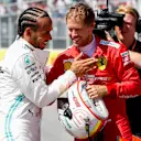 CIRCUIT GILLES-VILLENEUVE, CANADA - JUNE 08: Sebastian Vettel, Ferrari Pole sitter and Lewis Hamilton, Mercedes AMG F1 celebrate in Parc Ferme during the Canadian GP at Circuit Gilles-Villeneuve on June 08, 2019 in Circuit Gilles-Villeneuve, Canada. (Photo by Steven Tee / LAT Images)