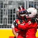 CIRCUIT GILLES-VILLENEUVE, CANADA - JUNE 08: Charles Leclerc, Ferrari, congratulates his team mate, Sebastian Vettel, Ferrari, on pole position during the Canadian GP at Circuit Gilles-Villeneuve on June 08, 2019 in Circuit Gilles-Villeneuve, Canada. (Photo by Zak Mauger / LAT Images)