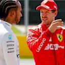 CIRCUIT GILLES-VILLENEUVE, CANADA - JUNE 08: Front row starters Lewis Hamilton, Mercedes AMG F1, and pole man Sebastian Vettel, Ferrari, talk after Qualifying during the Canadian GP at Circuit Gilles-Villeneuve on June 08, 2019 in Circuit Gilles-Villeneuve, Canada. (Photo by Steven Tee / LAT Images)