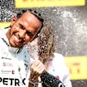 CIRCUIT GILLES-VILLENEUVE, CANADA - JUNE 09: Lewis Hamilton, Mercedes AMG F1, 1st position, sprays Champagne on the podium during the Canadian GP at Circuit Gilles-Villeneuve on June 09, 2019 in Circuit Gilles-Villeneuve, Canada. (Photo by Andy Hone / LAT Images)