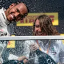 CIRCUIT GILLES-VILLENEUVE, CANADA - JUNE 09: Lewis Hamilton, Mercedes AMG F1, 1st position, sprays Champagne on the podium during the Canadian GP at Circuit Gilles-Villeneuve on June 09, 2019 in Circuit Gilles-Villeneuve, Canada. (Photo by Glenn Dunbar / LAT Images)