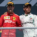 CIRCUIT GILLES-VILLENEUVE, CANADA - JUNE 09: Sebastian Vettel, Ferrari, 2nd position, and Lewis Hamilton, Mercedes AMG F1, 1st position, on the podium during the Canadian GP at Circuit Gilles-Villeneuve on June 09, 2019 in Circuit Gilles-Villeneuve, Canada. (Photo by Glenn Dunbar / LAT Images)