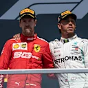 CIRCUIT GILLES-VILLENEUVE, CANADA - JUNE 09: Sebastian Vettel, Ferrari, 2nd position, and Lewis Hamilton, Mercedes AMG F1, 1st position, on the podium during the Canadian GP at Circuit Gilles-Villeneuve on June 09, 2019 in Circuit Gilles-Villeneuve, Canada. (Photo by Glenn Dunbar / LAT Images)