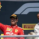 CIRCUIT GILLES-VILLENEUVE, CANADA - JUNE 09: Sebastian Vettel, Ferrari, 2nd position, lifts his trophy on the podium during the Canadian GP at Circuit Gilles-Villeneuve on June 09, 2019 in Circuit Gilles-Villeneuve, Canada. (Photo by Glenn Dunbar / LAT Images)