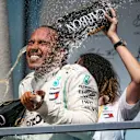 CIRCUIT GILLES-VILLENEUVE, CANADA - JUNE 09: Lewis Hamilton, Mercedes AMG F1, 1st position, celebrates on the podium with his team mate during the Canadian GP at Circuit Gilles-Villeneuve on June 09, 2019 in Circuit Gilles-Villeneuve, Canada. (Photo by Glenn Dunbar / LAT Images)