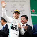 SHANGHAI INTERNATIONAL CIRCUIT, CHINA - APRIL 14: Valtteri Bottas, Mercedes AMG F1 celebrates on the podium during the Chinese GP at Shanghai International Circuit on April 14, 2019 in Shanghai International Circuit, China. (Photo by Glenn Dunbar / LAT Images)