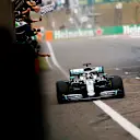 SHANGHAI INTERNATIONAL CIRCUIT, CHINA - APRIL 14: Lewis Hamilton, Mercedes AMG F1 W10, 1st position, crosses the line for victory to the delight of his team on the pit wall during the Chinese GP at Shanghai International Circuit on April 14, 2019 in Shanghai International Circuit, China. (Photo by Andy Hone / LAT Images)