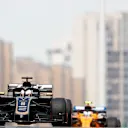 SHANGHAI INTERNATIONAL CIRCUIT, CHINA - APRIL 13: Romain Grosjean, Haas VF-19, leads Lando Norris, McLaren MCL34 during the Chinese GP at Shanghai International Circuit on April 13, 2019 in Shanghai International Circuit, China. (Photo by Glenn Dunbar / LAT Images)