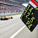 SHANGHAI INTERNATIONAL CIRCUIT, CHINA - APRIL 13: A team member pulls in the pit board after Charles Leclerc, Ferrari SF90, passes during the Chinese GP at Shanghai International Circuit on April 13, 2019 in Shanghai International Circuit, China. (Photo by Mark Sutton / Sutton Images)