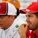 HOCKENHEIMRING, GERMANY - JULY 25: Sebastian Vettel, Ferrari and Kimi Raikkonen, Alfa Romeo Racing In the Press Conference during the German GP at Hockenheimring on July 25, 2019 in Hockenheimring, Germany. (Photo by Mark Sutton / Sutton Images)