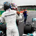 SILVERSTONE, UNITED KINGDOM - JULY 13: Pole Sitter Valtteri Bottas, Mercedes AMG F1 and Lewis Hamilton, Mercedes AMG F1 celebrate in Parc Ferme during the British GP at Silverstone on July 13, 2019 in Silverstone, United Kingdom. (Photo by Glenn Dunbar / LAT Images)