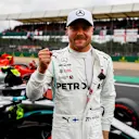 SILVERSTONE, UNITED KINGDOM - JULY 13: Pole man Valtteri Bottas, Mercedes AMG F1, celebrates after Qualifying during the British GP at Silverstone on July 13, 2019 in Silverstone, United Kingdom. (Photo by Glenn Dunbar / LAT Images)