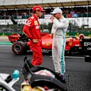 SILVERSTONE, UNITED KINGDOM - JULY 13: Charles Leclerc, Ferrari, talks with pole man Valtteri Bottas, Mercedes AMG F1, after Qualifying during the British GP at Silverstone on July 13, 2019 in Silverstone, United Kingdom. (Photo by Glenn Dunbar / LAT Images)