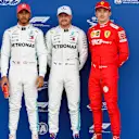 SILVERSTONE, UNITED KINGDOM - JULY 13: Top three Qualifiers Lewis Hamilton, Mercedes AMG F1, pole man Valtteri Bottas, Mercedes AMG F1, and Charles Leclerc, Ferrari during the British GP at Silverstone on July 13, 2019 in Silverstone, United Kingdom. (Photo by Zak Mauger / LAT Images)