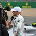 SILVERSTONE, UNITED KINGDOM - JULY 13: Pole man Valtteri Bottas, Mercedes AMG F1, is interviewed after Qualifying during the British GP at Silverstone on July 13, 2019 in Silverstone, United Kingdom. (Photo by Mark Sutton / Sutton Images)