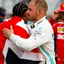 SILVERSTONE, UNITED KINGDOM - JULY 14: Race winner Lewis Hamilton, Mercedes AMG F1 and Valtteri Bottas, Mercedes AMG F1 celebrate in Parc Ferme during the British GP at Silverstone on July 14, 2019 in Silverstone, United Kingdom. (Photo by Zak Mauger / LAT Images)