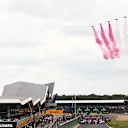 SILVERSTONE, UNITED KINGDOM - JULY 14: The Red Arrows fly over the grid during the British GP at Silverstone on July 14, 2019 in Silverstone, United Kingdom. (Photo by JEP / LAT Images)