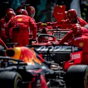 SILVERSTONE, UNITED KINGDOM - JULY 14: Charles Leclerc, Ferrari SF90, pit stops behind Max Verstappen, Red Bull Racing RB15 during the British GP at Silverstone on July 14, 2019 in Silverstone, United Kingdom. (Photo by Glenn Dunbar / LAT Images)