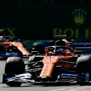 HUNGARORING, HUNGARY - AUGUST 04: Carlos Sainz, McLaren MCL34, leads Lando Norris, McLaren MCL34 during the Hungarian GP at Hungaroring on August 04, 2019 in Hungaroring, Hungary. (Photo by Zak Mauger / LAT Images)