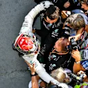 HUNGARORING, HUNGARY - AUGUST 04: Lewis Hamilton, Mercedes AMG F1, 1st position, celebrates with his team in Parc Ferme during the Hungarian GP at Hungaroring on August 04, 2019 in Hungaroring, Hungary. (Photo by Mark Sutton / Sutton Images)
