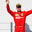 HUNGARORING, HUNGARY - AUGUST 04: Sebastian Vettel, Ferrari, 3rd position, arrives on the podium during the Hungarian GP at Hungaroring on August 04, 2019 in Hungaroring, Hungary. (Photo by Zak Mauger / LAT Images)