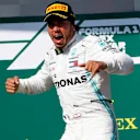 HUNGARORING, HUNGARY - AUGUST 04: Lewis Hamilton, Mercedes AMG F1, 1st position, arrives on the podium during the Hungarian GP at Hungaroring on August 04, 2019 in Hungaroring, Hungary. (Photo by Zak Mauger / LAT Images)