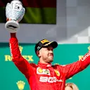 HUNGARORING, HUNGARY - AUGUST 04: Sebastian Vettel, Ferrari, 3rd position, celebrates with his trophy during the Hungarian GP at Hungaroring on August 04, 2019 in Hungaroring, Hungary. (Photo by Joe Portlock / LAT Images)