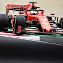 SUZUKA, JAPAN - OCTOBER 11: Sparks fly behind Sebastian Vettel of Germany driving the (5) Scuderia Ferrari SF90 on track during practice for the F1 Grand Prix of Japan at Suzuka Circuit on October 11, 2019 in Suzuka, Japan. (Photo by Clive Mason/Getty Images)