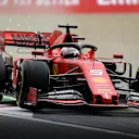 SUZUKA, JAPAN - OCTOBER 11: Sparks fly behind Sebastian Vettel of Germany driving the (5) Scuderia Ferrari SF90 on track during practice for the F1 Grand Prix of Japan at Suzuka Circuit on October 11, 2019 in Suzuka, Japan. (Photo by Clive Mason/Getty Images)