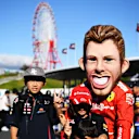 SUZUKA, JAPAN - OCTOBER 13: Red Bull Racing fans and Ferrari fans show their support before